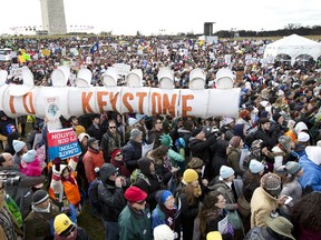 Protestors gather at the National Mall in Washington calling on President Barack Obama to reject the Keystone XL oil pipeline from Canada, as well as act to limit carbon pollution from power plants and “move beyond” coal and natural gas, Sunday, Feb. 17, 2013. (AP Photo/Manuel Balce Ceneta)