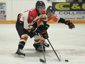 Essex's Jordan Brohman, right, battles Kingsville's Tyler Kirby during Game 1 of their junior C playoff series Tuesday, Feb. 5, 2013, at Essex Arena. (DAN JANISSE/The Windsor Star)