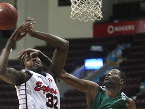 Windsor's Daniel Rose, left, and Montreal's Jonas Pierre battle for the ball during their NBL of Canada game Wednesday, Feb. 27, 2013, at the WFCU Centre. The Express beat the Jazz 115-73. (DAN JANISSE/The Windsor Star)