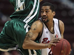 Windsor Express guard Mike Helms, right, gets bumped by Montreal's Courtland Bluford during an NBL game Wednesday, Feb. 13, 2013 at the WFCU Centre in Windsor. The Express beat the Jazz 105-91. (DAN JANISSE/The Windsor Star)