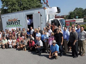 Stafff from Russell A. Farrow, United Way, the CAW and local food banks pose for a photo with a truck that was donated by the Russell A. Farrow Company in Windsor in June 2012. The  company has been recognized as one of the best managed in Canada for the fourth time. (The Windsor Star / TYLER BROWNBRIDGE)