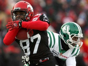 LaSalle's Arjei Franklin of the Calgary Stampeders gets past the Saskatchewan's' Leron Mitchell for a touchdown in the CFL West Final in Calgary Nov. 21, 2010. (Stuart Gradon/Calgary Herald)