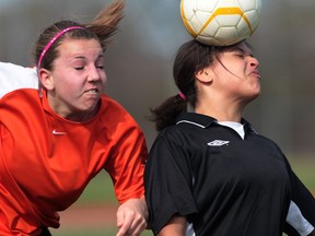Files: Riverside' s Kiana Crosby, right,  heads the ball while Sandwich's Sydney Hockley at left, presses on senior girls soccer action in LaSalle,  on April 13, 2012. (Windsor Star files)