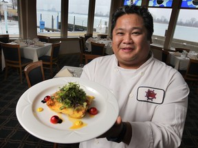 Windsor Yacht Club chef Anthony-John Dalupan displays a dish made with greenhouse tomatoes, in Windsor, Ont.  (DAN JANISSE/The Windsor Star)