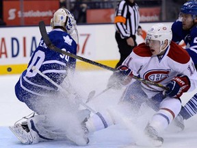 Toronto goalie Ben Scrivens stops Montreal winger Brendan Gallagher, centre, as Leafs winger James van Riemsdyk defends during NHL action in Toronto Wednesday Feb. 27, 2013. (THE CANADIAN PRESS/Frank Gunn)