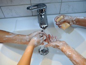 Because the flu virus is mostly airborne, simply washing your hands won't guarantee immunity from the flu. (THOMAS LOHNES /AFP/ Getty Images)