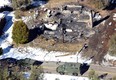 In this aerial photo, law enforcement authorities investigate the burn-out cabin Wednesday, Feb.13, 2013 where accused quadruple-murder suspect Christopher Dorner was believed to have died after barricading himself inside, during a Tuesday stand-off with police in the Angeles Oaks area of Big Bear, Calif. (AP Photo/The Sun, John Valenzuela)