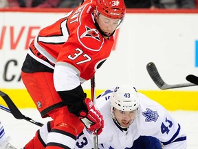 Toronto's Nazem Kadri, right, battles for the puck with Carolina's Tim Brent at PNC Arena on February 14, 2013 in Raleigh, N.C. (Grant Halverson/Getty Images)