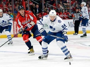 Toronto's Mikhail Grabovski, right, brings the puck up the ice against Washington's Alex Ovechkin at the Verizon Center Feb. 5, 2013 in Washington, DC. (Greg Fiume/Getty Images)