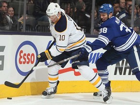 Toronto's Frazer McLaren, right, battles with Buffalo's Christian Ehrhoff during NHL action at the Air Canada Centre Feb. 21, 2013 in Toronto. (Abelimages/Getty Images)