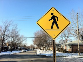 A traffic sign warns motorists to be careful for pedestrians in the 1100 block of Coventry Court, Windsor, Ont. Photographed Feb. 6, 2013. (Dalson Chen / The Windsor Star)