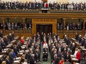 Lieutenant Governor David Onley leads a procession followed by Premier Kathleen Wynne into the Ontario Legislature before delivering the throne speech on Tuesday.  (THE CANADIAN PRESS/Chris Young)