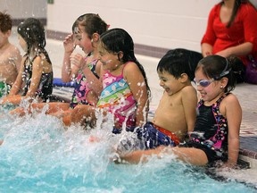A group of children splash during a swimming lesson at Windsor Water World in Windsor on Tuesday, February 12, 2013.   (TYLER BROWNBRIDGE / The Windsor Star)
