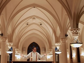 Rev. Chris Valka delivers mass at the Assumption University chapel in Windsor on Monday, February 11, 2013. Catholics around the world were shocked by Pope Benedict XVI decision to retire. (TYLER BROWNBRIDGE / The Windsor Star)