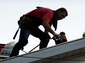 A roofer goes to work in this Windsor Star file photo. (The worker and his company have no connection to the case cited below.)