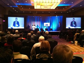 Urbanist Richard Florida tells seated Windsor crowd about the dangers of too much sitting. (Doug Schmidt/The Windsor Star)
