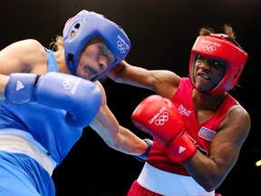 U.S. boxer Claressa Shields, right, exchanges punches with Russia's Nadezda Torlopova during the women's 75kg) final at the 2012 Olympic Games August 9, 2012 in London, England. Shields will fight Windsor's Mary Spencer Saturday in Lansing, Mich. (Scott Heavey/Getty Images)