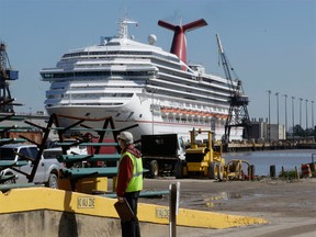 The Carnival Triumph sits at its dock in Mobile, Alabama, after five days powerless in the Gulf of Mexico. Photographed Feb. 15, 2013. (Dave Martin / Associated Press)