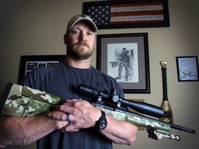 In this April 6, 2012, photo, former Navy SEAL and author of the book “American Sniper”, Chris Kyle poses in Midlothian, Texas. A Texas sheriff has told local newspapers that Kyle has been fatally shot along with another man on a gun range, Saturday, Feb. 2, 2013. (AP Photo/The Fort Worth Star-Telegram, Paul Moseley)