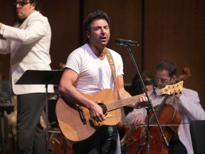 In this file photo, Jody Raffoul performs with the Windsor Symphony Orchestra, Friday, Feb. 22, 2013, at the Capitol Theatre in Windsor, Ont. using the Six String Nation guitar.  (DAN JANISSE/The Windsor Star)