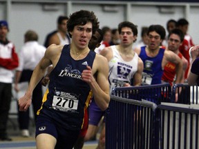 The University of Windsor Lancers Corey Bellemore leads the pack in the men's 600m at the OUA Track and Field meet at the St. Denis Centre in Windsor on Friday, February 22, 2013.               (TYLER BROWNBRIDGE / The Windsor Star)