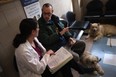 When you arrive at the veterinarian's office, make sure you are prepared with information about your pet and even have a list of questions for the vet. (John Moore / Getty Images files)