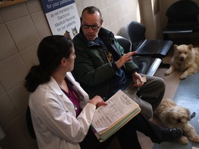 When you arrive at the veterinarian's office, make sure you are prepared with information about your pet and even have a list of questions for the vet. (John Moore / Getty Images files)