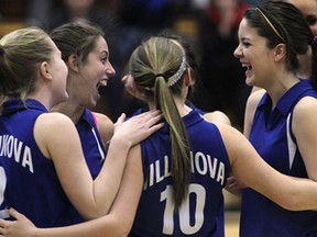 Villanova's Courtney Lafleur, from left, Rachael Durocher, Madison Trotter and Katie Clark celebrate their win Thursday, Feb. 21, 2013 against St. Joseph at the SWOSSAA girls AAA volleyball qualifier in LaSalle. The Wildcats beat the Lasers 3-0 (25-15, 25-20, 25-15).  (DAN JANISSE/The Windsor Star)