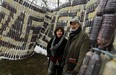 Windsor artists Phil McLeod (R) and Lorraine Steele (L) stand by their War of 1812 Peace Wampum Belt - a new permanent public art piece at Patterson Park in the west end. Photographed Feb. 26, 2013. (Tyler Brownbridge / The Windsor Star)
