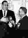 Long before he was making headlines on Parliament Hill, Eugene Whelan served as Warden of Essex County. In this file photo, he receives the gavel from retiring warden Robert McDonald.(Jan.17 1962. The Windsor Star files)