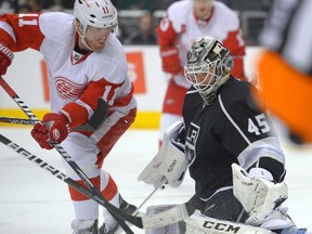Detroit's Daniel Cleary, left, tries to get a shot in on Los Angeles Kings goalie Jonathan Bernier during an NHL hockey game, Wednesday, Feb. 27, 2013, in Los Angeles. (AP Photo/Mark J. Terrill)