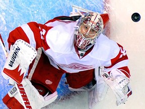 Detroit goalie Jimmy Howard looks up at the puck during NHL action against the Los Angeles Kings Wednesday, Feb. 27, 2013, in Los Angeles. (AP Photo/Mark J. Terrill)