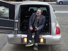 Reg Lansdowne, a former Windsor man now living in Wallaceburg, figures he doesnÕt have a lot of time left as he battles COPD, so earlier this week he threw himself a party Ð his own wake Ð with 100 of his closest friends.  Lansdowne is shown riding in the back of a funeral home hearse.