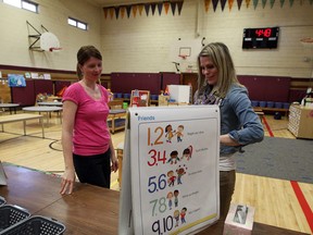 Hugh Beaton Public School teachers Megan Seal and Brittany Nguyen prepare their gym classroom for students when they return from March Break, Friday March 8, 2013. (NICK BRANCACCIO/The Windsor Star)