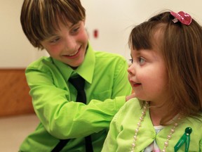 Kaidyn Blair, 10, left, and Emily Ledoux, 2, share a laugh at the Royal Canadian Legion in Essex, Friday, March 29, 2013. Kaidyn organized a registration drive to promote organ and tissue donation to mark the 10th anniversary of his liver transplant, April 27th.  (DAX MELMER/The Windsor Star)