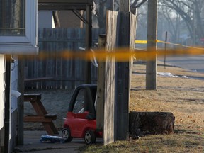 A child's toy sits in the backyard of a house at 1596 Aubin Road where a man was fatally stabbed in the early morning of Saturday, March 23, 2013.  (DAX MELMER/The Windsor Star)