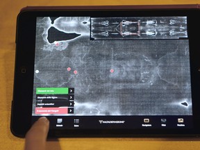 A picture taken on Saturday, March 30, 2013 in Rome shows a screen displaying 'The Shroud of Turin' with the Shroud 2.0 app. On Good Friday, a Piedmont company, Haltadefinizione, introduced a new app, Shroud 2.0, which features images of the cloth along with scientific and theological interpretations prepared with the Diocese of Turin and the International Center of Sindonology. Sindonology is the scientific study of the shroud. (VINCENZO PINTO/AFP/Getty Images)