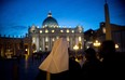 A nun walks in front of St Peter's basilica at the Vatican ahead of the cardinals conclave on March 9, 2013 at the Vatican. The Vatican installed a special chimney on the Sistine Chapel from which white smoke will signal the election of a new leader of the world's 1.2 billion Catholics as cardinals prepare for the centuries-old tradition starting on Tuesday.  (JOHANNES EISELE/AFP/Getty Images)