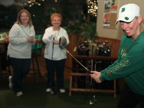 WonderBroad Peggy Hurley tees off at the Wearing of the Green at On the Green fundraiser in Tecumseh, Saturday, March 16, 2013. The fundraiser was put on by the Wonder Broads Charitable Dragon Boat Racing Organization.  (DAX MELMER/The Windsor Star)