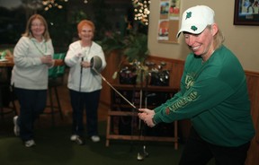 WonderBroad Peggy Hurley tees off at the Wearing of the Green at On the Green fundraiser in Tecumseh, Saturday, March 16, 2013. The fundraiser was put on by the Wonder Broads Charitable Dragon Boat Racing Organization.  (DAX MELMER/The Windsor Star)