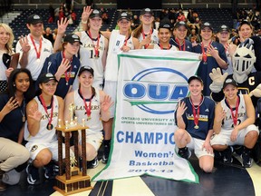 The Windsor Lancers celebrate their OUA basketball title Saturday at the St. Denis Centre. (Courtesy of Edwin Tam/University of Windsor)