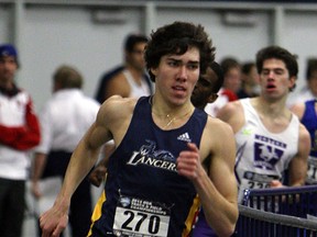 The University of Windsor's Corey Bellemore leads the pack in the men's 600m at the OUA track and field meet at the St. Denis Centre. (TYLER BROWNBRIDGE/The Windsor Star)