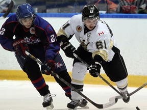 LaSalle's Eric Noel, right,  battles with Strathroy's Max Naus in Game 5 at the Vollmer Centre.   (NICK BRANCACCIO/The Windsor Star)