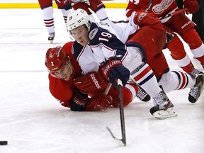 Detroit's Brendan Smith, left, pulls down Ryan Johansen of the  Blue Jackets Saturday at Nationwide Arena in Columbus, Ohio. (Photo by Kirk Irwin/Getty Images)