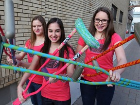 Kristi Campbell, left, Madeline Ellepola and Mandy Johnstone of Krazy Krutches for Kids prepare to make their pitch to win $1,000 from Awesome Foundation of Windsor-Essex at Squirrel Cage Wednesday March 13, 2013. Krazy Krutches of Kids will decorate medical crutches for children recovering from injury. (NICK BRANCACCIO/The Windsor Star)