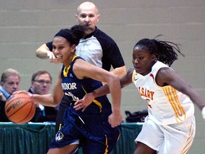 Windsor's Miah-Marie Langlois, left, is guarded by Calgary's  Tamara Jarrett at the CIS Women's Basketball Championship at the University of Regina.(Michael Bell/Leader-Post)