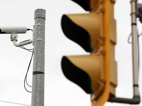 A traffic camera keeps watch over the intersection of Ouellette Avenue and Tecumseh Road in Windsor, Ont. on Wednesday, March 6, 2013. The city will spend $2 million to install similar cameras across the city to improve traffic flow.                   (TYLER BROWNBRIDGE / The Windsor Star)