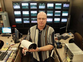 John Wolf holds a traffic camera at the traffic control offices in Windsor, Ont. on Wednesday, March 6, 2013. The city will spend $2 million to install similar cameras across the city to improve traffic flow.                   (TYLER BROWNBRIDGE / The Windsor Star)