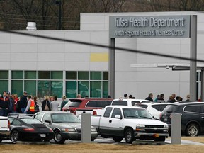About 150 to 200 patients of Dr. W. Scott Harrington, who's accused of unsanitary practices, line up outside the Tulsa Health Department North Regional Health and Wellness Center to be screened for hepatitis and the virus that causes AIDS. (James Gibbard)