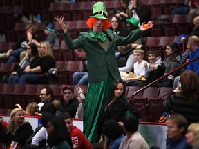 A member of the Stilt Guys dressed as a leprechaun entertains the crowd  at the WFCU Centre as the Windsor Express host the Oshawa Power, Saturday, March 16, 2013.  (DAX MELMER/The Windsor Star)